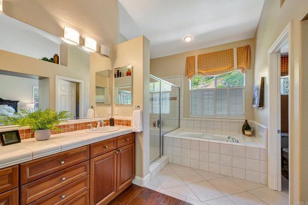 Bathroom, Glass Shower, Interior, Recessed Lighting, Tile Countertops, Wood Texture Flooring