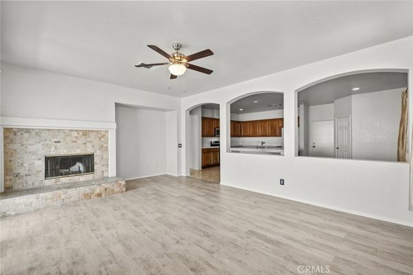 Empty room, Fireplace, Interior, Kitchen, Recessed Lighting, Wood Texture Flooring
