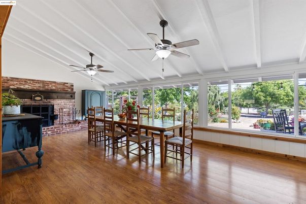 Dining room, Fireplace, Interior, Stone Walls, Sun Room, Wood Texture Flooring