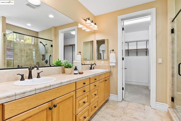 Bathroom, Dual Sink Vanities, Glass Shower, Interior, Recessed Lighting, Tile Countertops