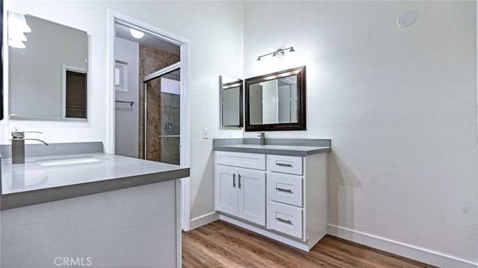 Bathroom, Dual Sink Vanities, Glass Shower, Interior, Wood Texture Flooring