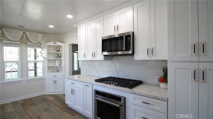 Interior, Kitchen, Marble Walls, Recessed Lighting, Stainless Steel Appliances, Wood Texture Flooring