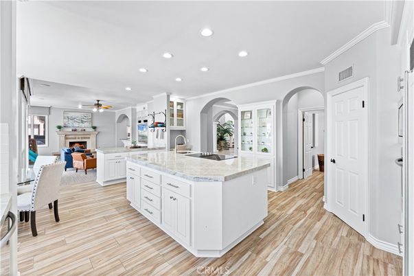 Dining room, Fireplace, Interior, Kitchen, Recessed Lighting, Wood Texture Flooring