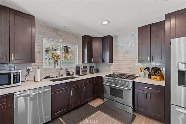 Interior, Kitchen, Recessed Lighting, Stainless Steel Appliances, Stone Walls, Wood Texture Flooring