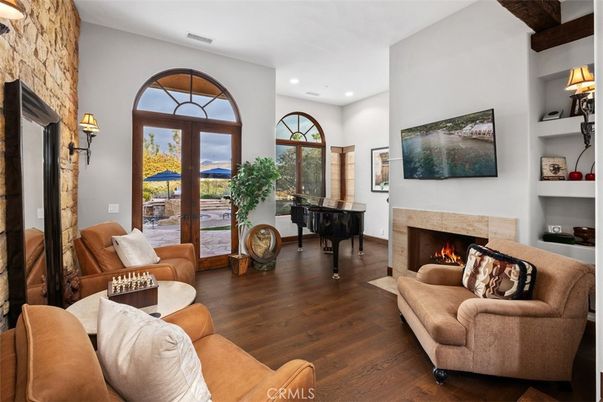 Fireplace, Interior, Living room, Piano, Recessed Lighting, Wood Texture Flooring