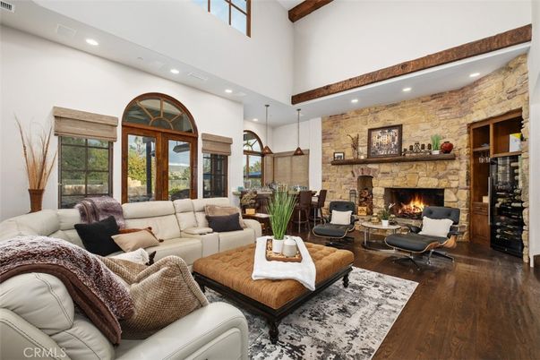 Dining room, Fireplace, Interior, Living room, Pendant Lights, Recessed Lighting, Stone Walls, Wooden Beams, Wood Texture Flooring