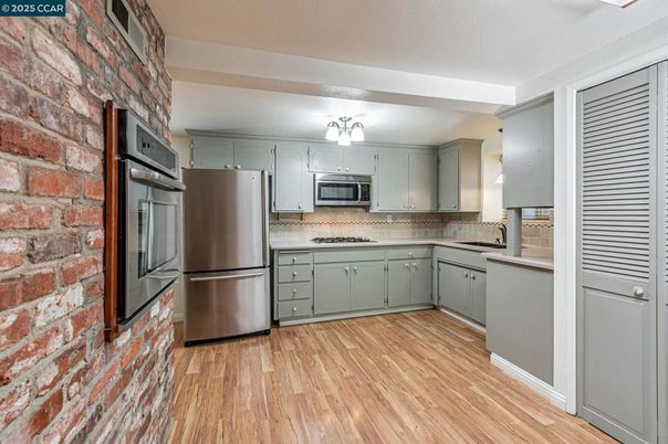 Interior, Kitchen, Stainless Steel Appliances, Stone Walls, Wood Texture Flooring