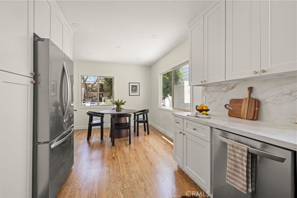 Dining room, Interior, Kitchen, Marble Walls, Recessed Lighting, Stainless Steel Appliances, Wood Texture Flooring