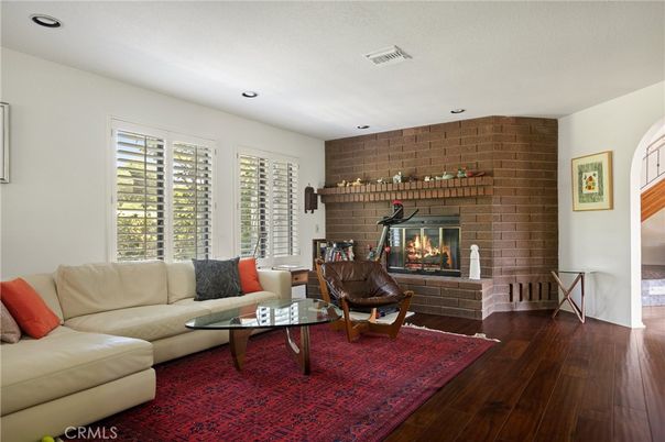 Fireplace, Interior, Living room, Recessed Lighting, Stone Walls, Wood Texture Flooring