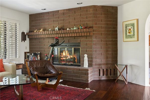 Fireplace, Fitness Equipment, Interior, Recessed Lighting, Stone Walls, Wood Texture Flooring
