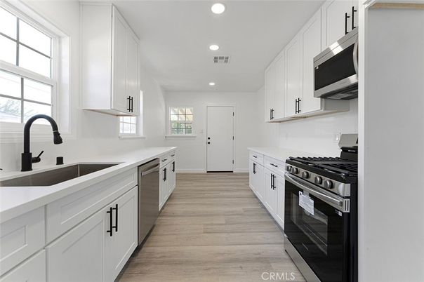 Interior, Kitchen, Recessed Lighting, Stainless Steel Appliances, Wood Texture Flooring