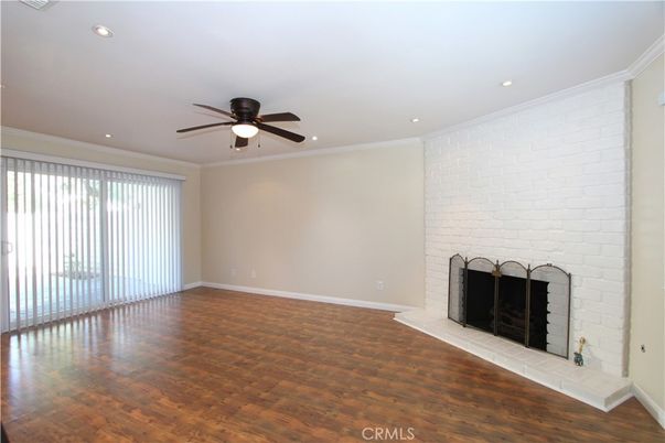 Empty room, Fireplace, Interior, Recessed Lighting, Stone Walls, Wood Texture Flooring