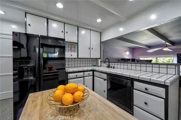 Interior, Kitchen, Recessed Lighting, Tile Countertops, Wood Texture Flooring