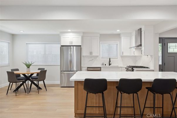 Dining room, Interior, Kitchen, Marble Walls, Recessed Lighting, Stainless Steel Appliances, Wood Texture Flooring
