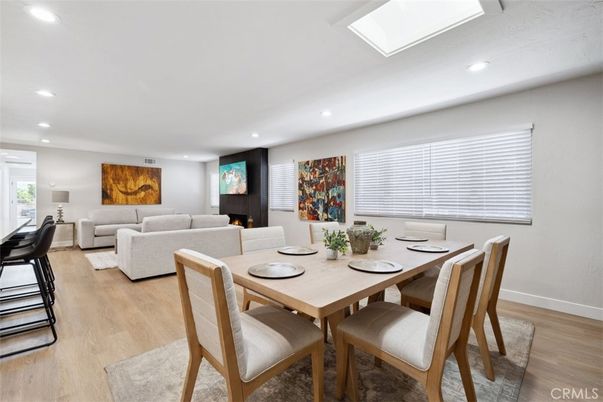Dining room, Fireplace, Interior, Living room, Recessed Lighting, Wood Texture Flooring