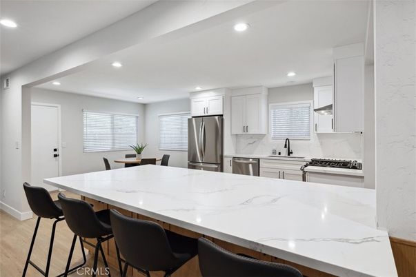 Dining room, Interior, Kitchen, Recessed Lighting, Stainless Steel Appliances, Wood Texture Flooring