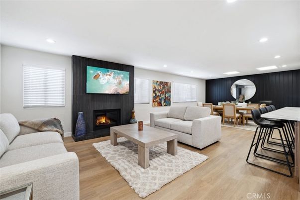 Dining room, Fireplace, Interior, Living room, Recessed Lighting, Wood Texture Flooring
