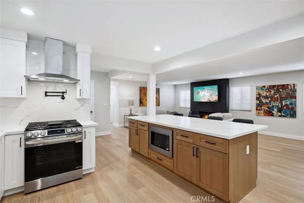 Interior, Kitchen, Marble Walls, Recessed Lighting, Stainless Steel Appliances, Wood Texture Flooring