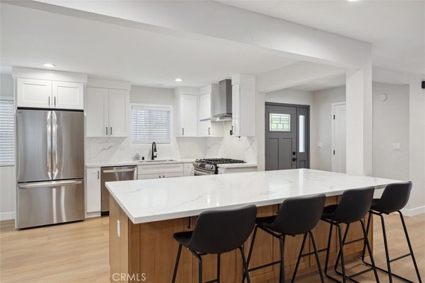 Interior, Kitchen, Marble Walls, Recessed Lighting, Stainless Steel Appliances, Wood Texture Flooring