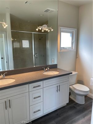 Bathroom, Dual Sink Vanities, Glass Shower, Interior, Wood Texture Flooring