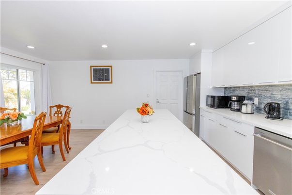 Dining room, Interior, Kitchen, Recessed Lighting, Stainless Steel Appliances, Wood Texture Flooring