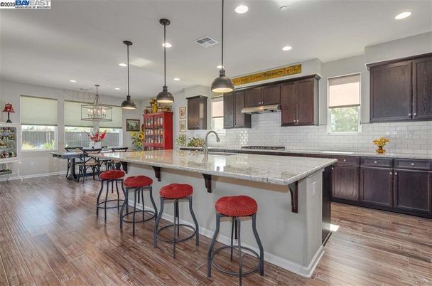 Dining room, Interior, Kitchen, Pendant Lights, Recessed Lighting, Stainless Steel Appliances, Wood Texture Flooring