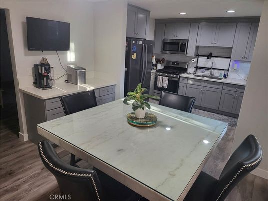 Dining room, Interior, Kitchen, Recessed Lighting, Stainless Steel Appliances, Wood Texture Flooring
