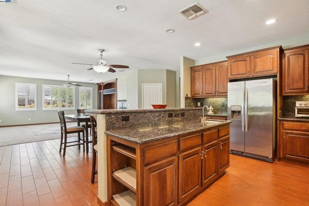 Dining room, Interior, Kitchen, Recessed Lighting, Stainless Steel Appliances, Wood Texture Flooring