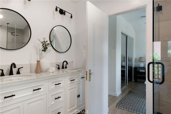 Bathroom, Dual Sink Vanities, Glass Shower, Interior, Wood Texture Flooring