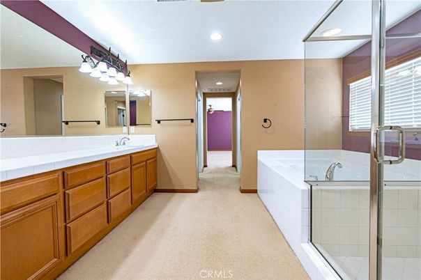 Bathroom, Dual Sink Vanities, Glass Shower, Interior, Recessed Lighting, Tile Countertops
