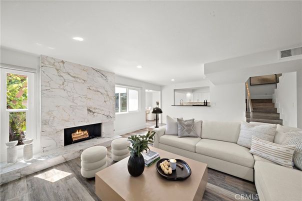 Fireplace, Interior, Living room, Marble Walls, Recessed Lighting, Wood Texture Flooring