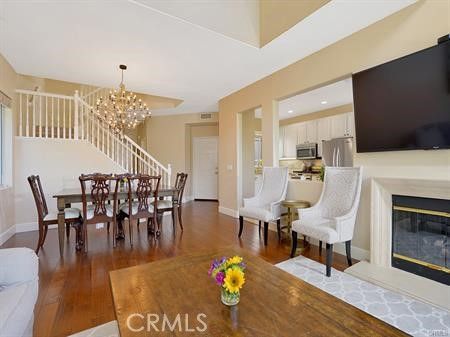 Chandelier, Dining room, Fireplace, Interior, Kitchen, Recessed Lighting, Stainless Steel Appliances, Wood Texture Flooring