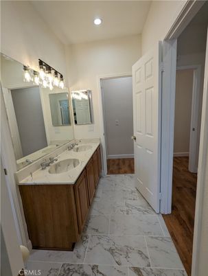 Bathroom, Dual Sink Vanities, Interior, Marble, Recessed Lighting, Wood Texture Flooring