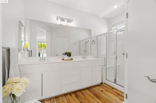 Bathroom, Dual Sink Vanities, Glass Shower, Interior, Recessed Lighting, Wood Texture Flooring