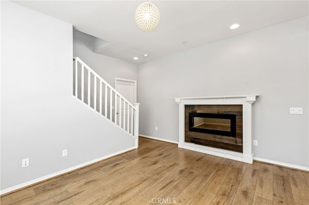 Empty room, Fireplace, Interior, Recessed Lighting, Wood Texture Flooring