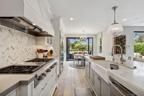 Chandelier, Dining room, Interior, Kitchen, Pendant Lights, Recessed Lighting, Stainless Steel Appliances, Wood Texture Flooring