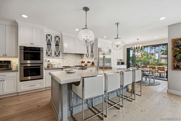 Chandelier, Dining room, Interior, Kitchen, Pendant Lights, Recessed Lighting, Stainless Steel Appliances, Wood Texture Flooring