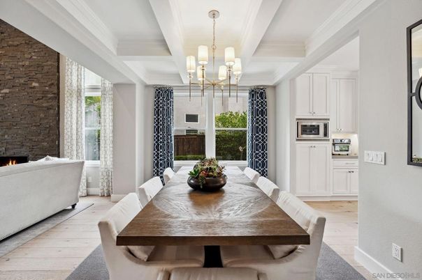 Chandelier, Dining room, Fireplace, Interior, Living room, Pendant Lights, Stone Walls, Wood Texture Flooring