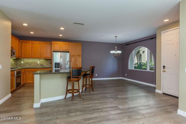 Chandelier, Interior, Kitchen, Pendant Lights, Recessed Lighting, Stainless Steel Appliances, Wood Texture Flooring