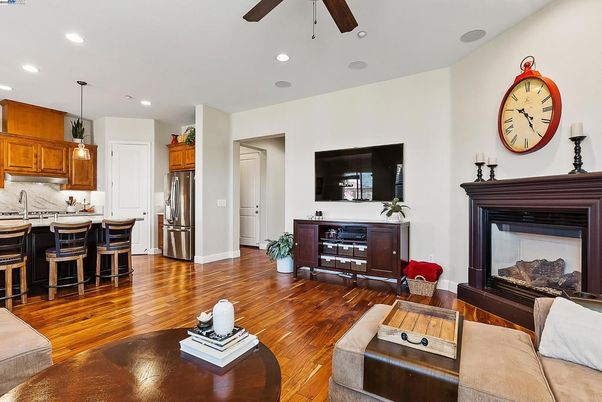 Fireplace, Interior, Kitchen, Living room, Pendant Lights, Recessed Lighting, Stainless Steel Appliances, Wood Texture Flooring