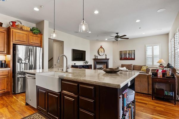Fireplace, Interior, Kitchen, Living room, Pendant Lights, Recessed Lighting, Stainless Steel Appliances, Wood Texture Flooring