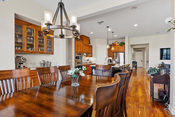 Dining room, Interior, Kitchen, Pendant Lights, Recessed Lighting, Stainless Steel Appliances, Wood Texture Flooring