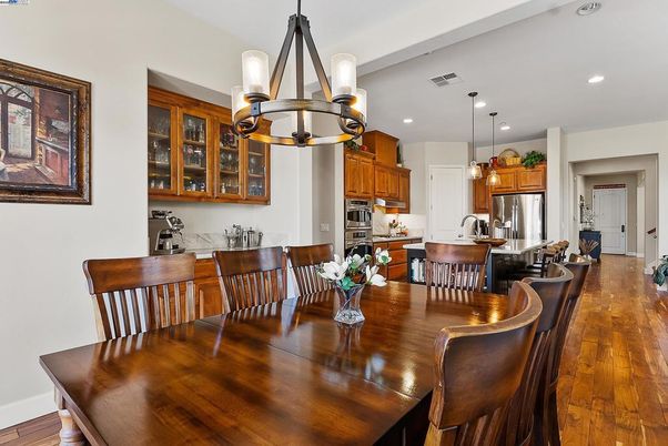 Dining room, Interior, Kitchen, Pendant Lights, Recessed Lighting, Stainless Steel Appliances, Wood Texture Flooring