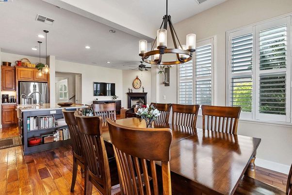 Dining room, Fireplace, Interior, Kitchen, Pendant Lights, Recessed Lighting, Stainless Steel Appliances, Wood Texture Flooring