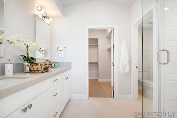 Bathroom, Dual Sink Vanities, Glass Shower, Interior, Walk-in Closets, Wood Texture Flooring
