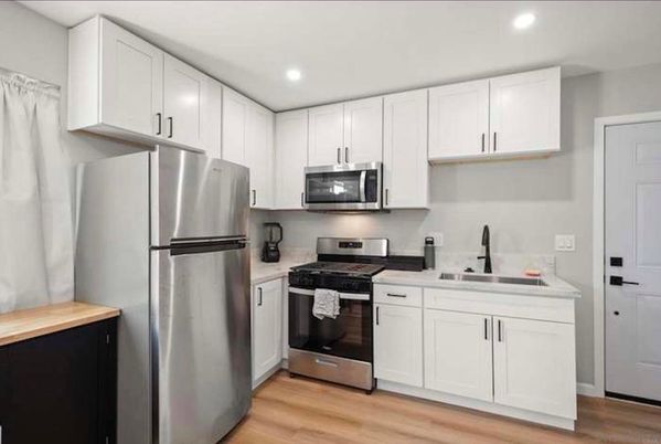 Interior, Kitchen, Recessed Lighting, Stainless Steel Appliances, Wood Texture Flooring