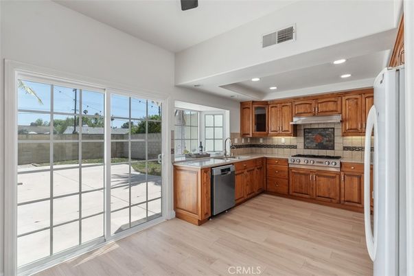 Interior, Kitchen, Recessed Lighting, Tile Countertops, Wood Texture Flooring
