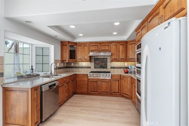 Interior, Kitchen, Recessed Lighting, Stainless Steel Appliances, Tile Countertops, Wood Texture Flooring