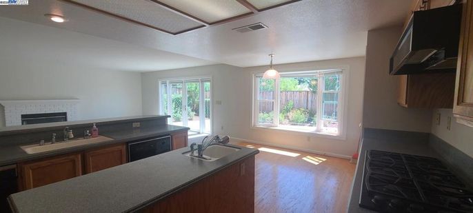 Fireplace, Interior, Kitchen, Pendant Lights, Recessed Lighting, Wood Texture Flooring
