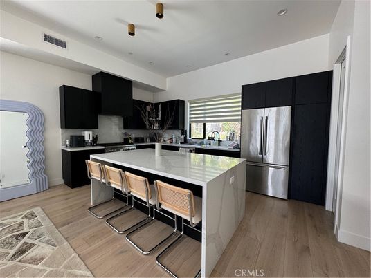 Interior, Kitchen, Marble Walls, Recessed Lighting, Stainless Steel Appliances, Wood Texture Flooring